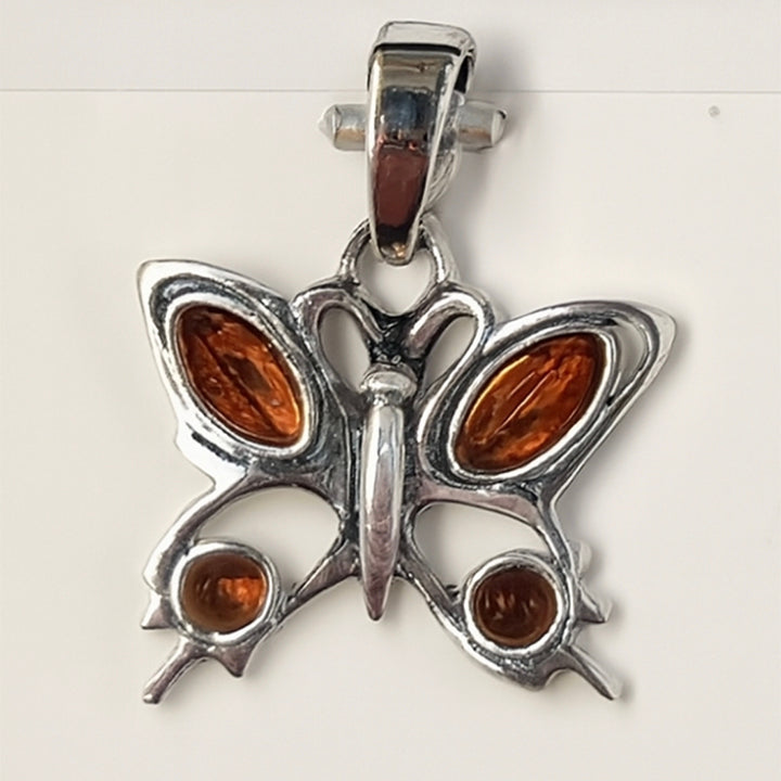 Pendant Baltic Amber butterfly sterling silver