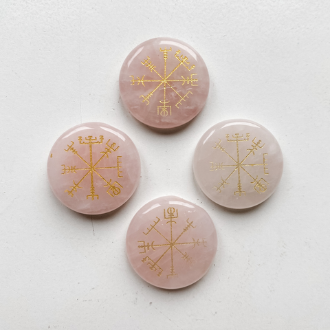 Rose quartz disc with rune symbols